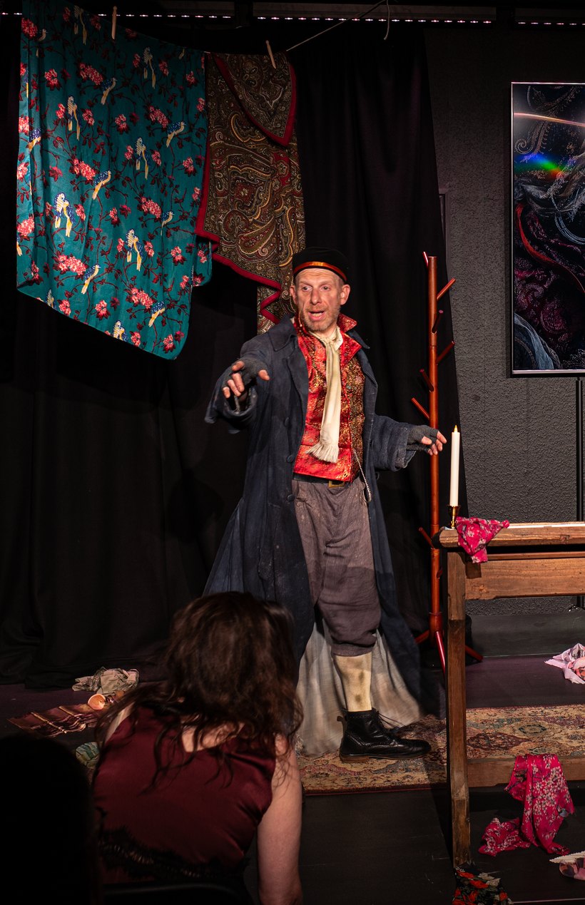Steve Furst as Fagin, reaching out to the audience