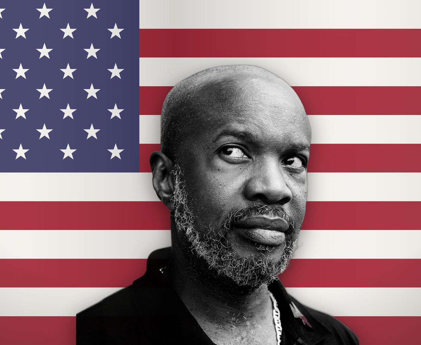 David McAlmont, in black and white, in front of the American flag